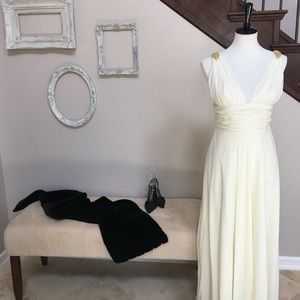 Long ivory gown with gold jewelry accent